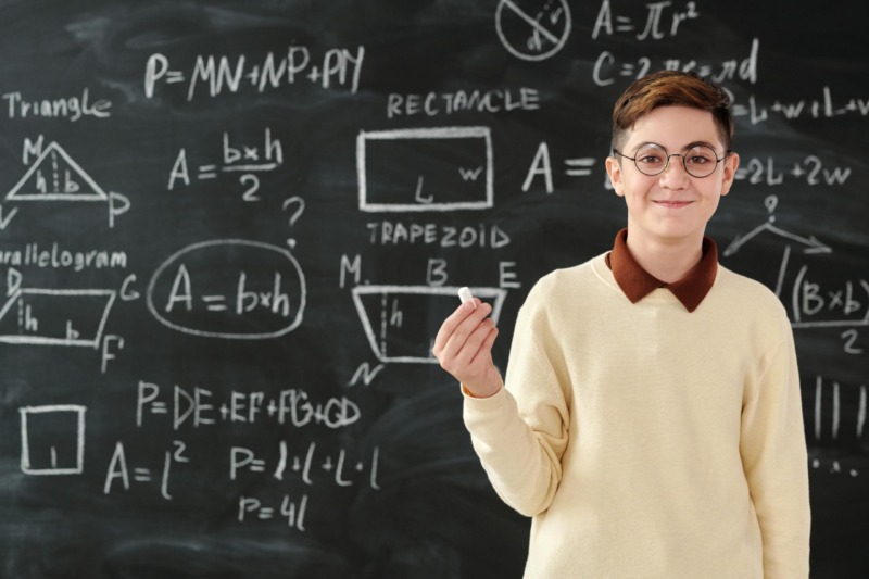 A Boy Holding a Chalk